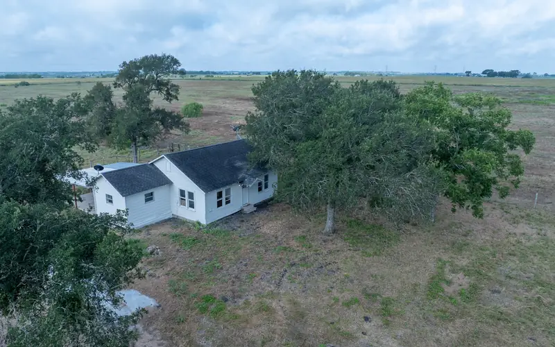 Aerial view of the farmhouse and cleared land on Tract 3, La Grange, Texas.