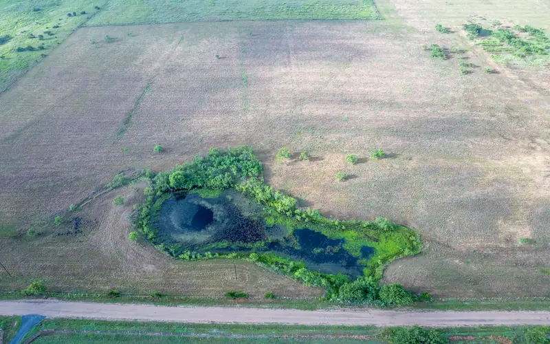 Aerial view of the pond and cleared land on Tract 5, La Grange, Texas.